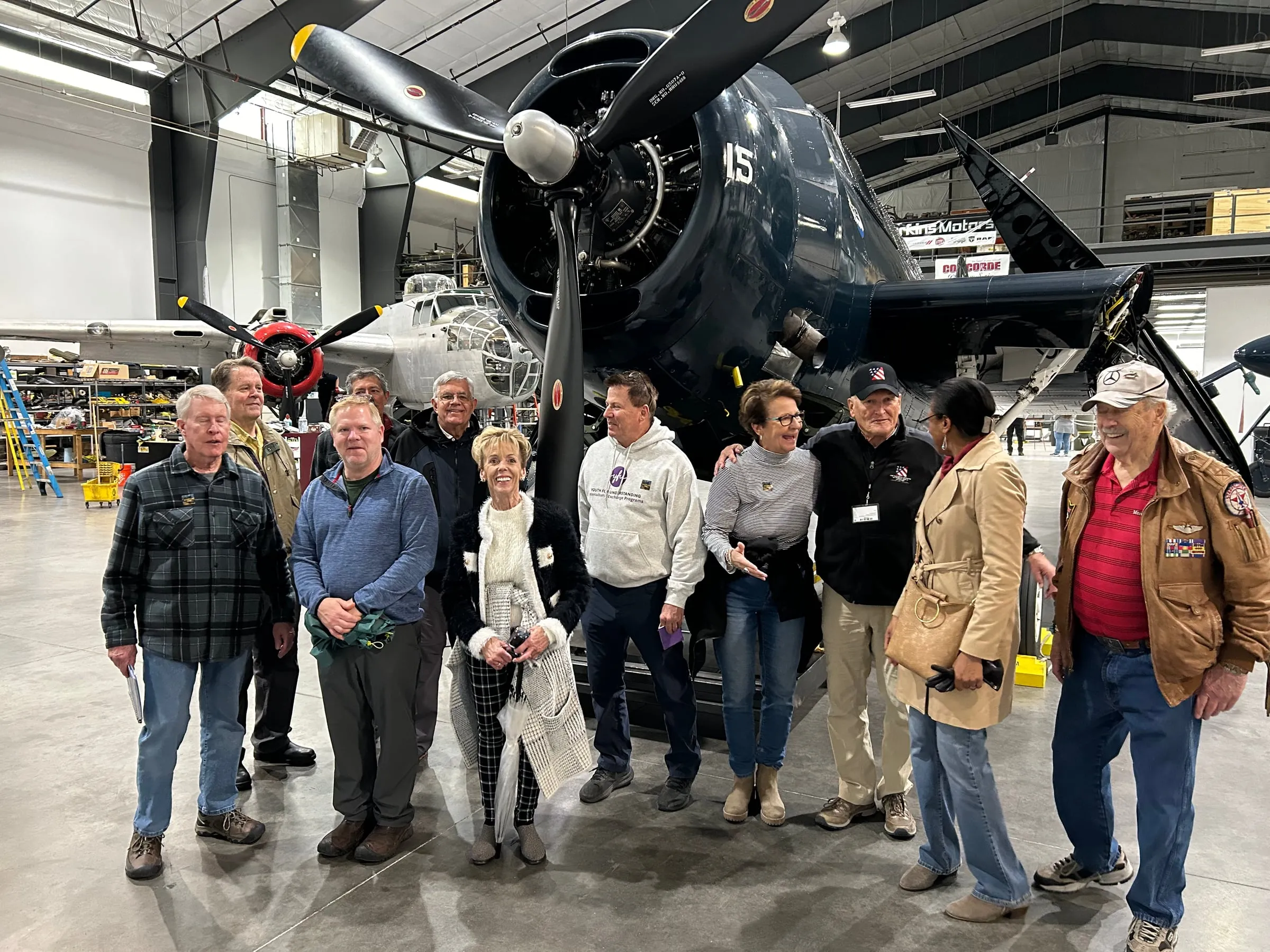 Pikes Peak Club members on a group outing at an aircraft museum