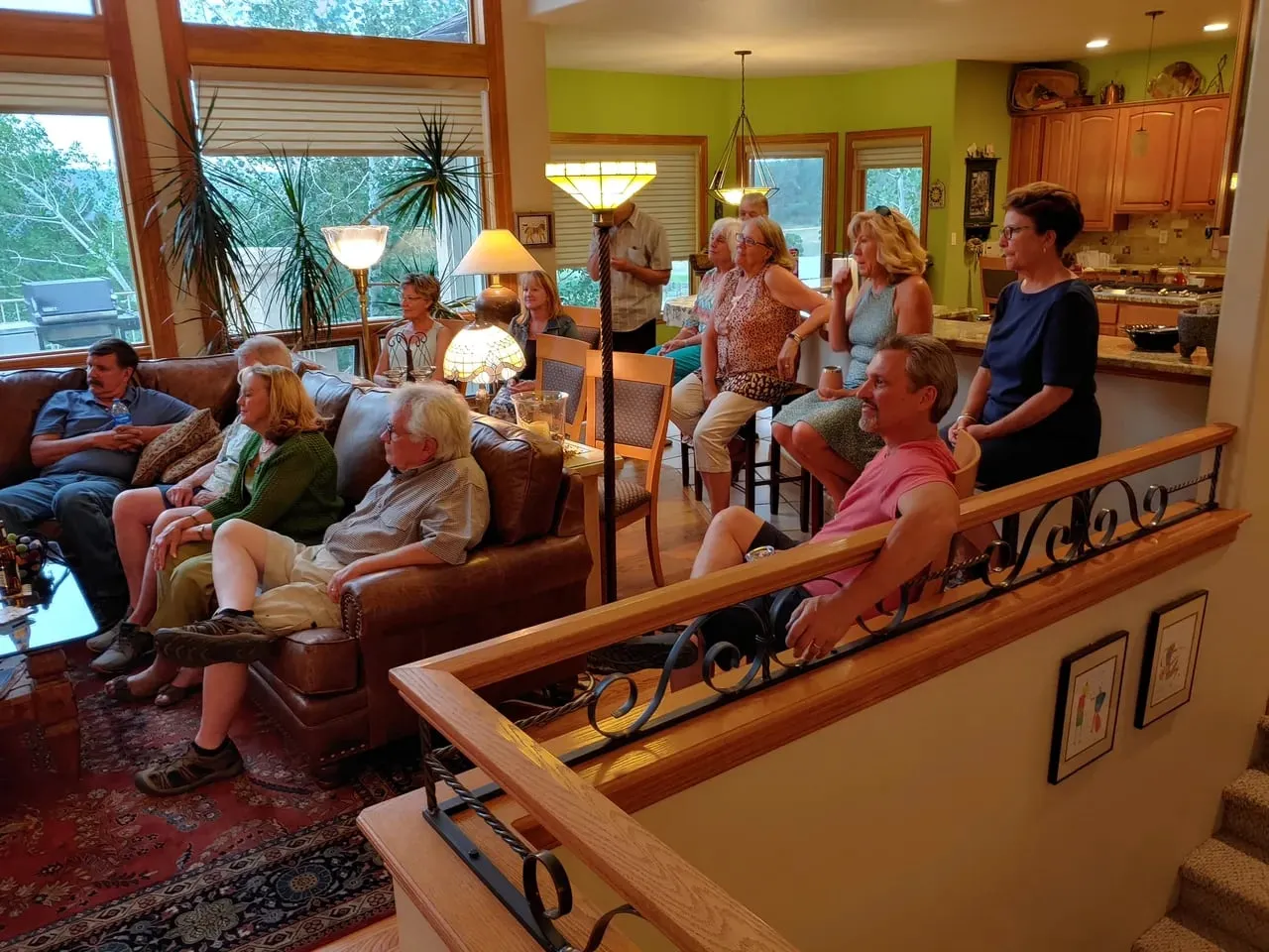 Members gathered in a living room for a club social