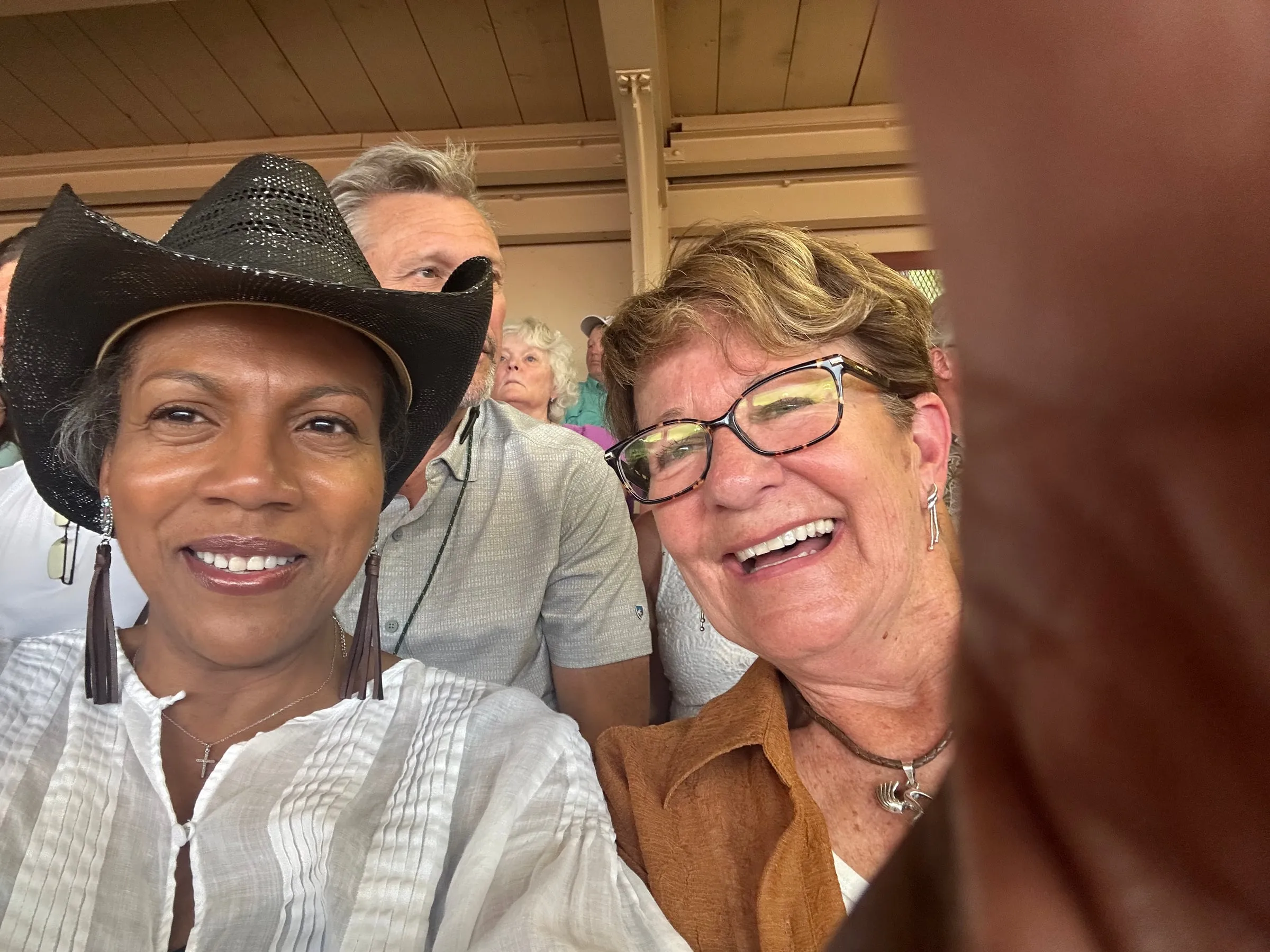 Two members sharing a laugh at a club outing
